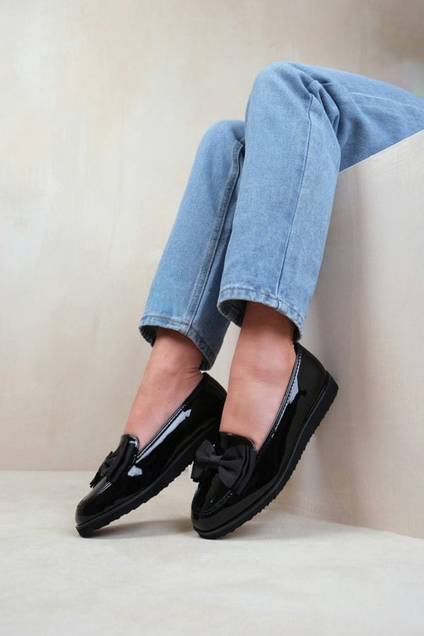 Where's That From ALPHA SLIP ON LOAFER SLIDER WITH BOW DETAIL IN BLACK PATENT FAUX LEATHER