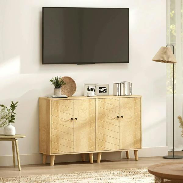 Natural wood storage cabinet with double chevron doors and round dark knobs, pine legs