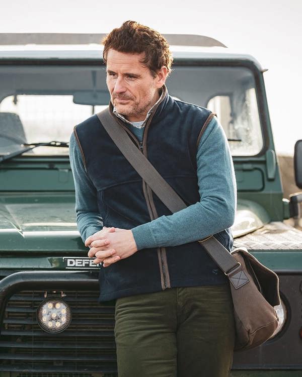 Man wearing Hoggs of Fife Stenton fleece gilet on shoot, warm field layer for farmers and gamekeepers