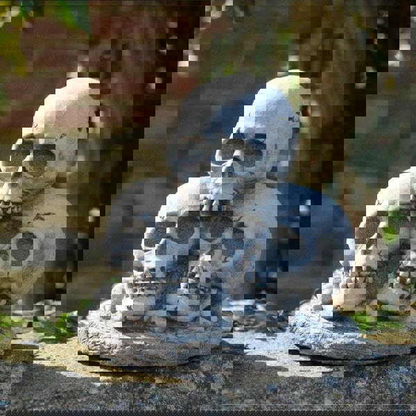 Three Skull Stone cast Garden Ornament
