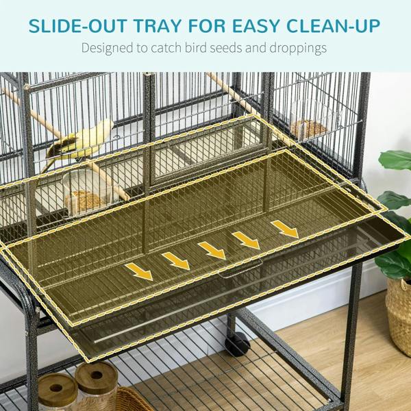 Black bird cage with removable slide-out tray and lower shelf; wire base on wheels
