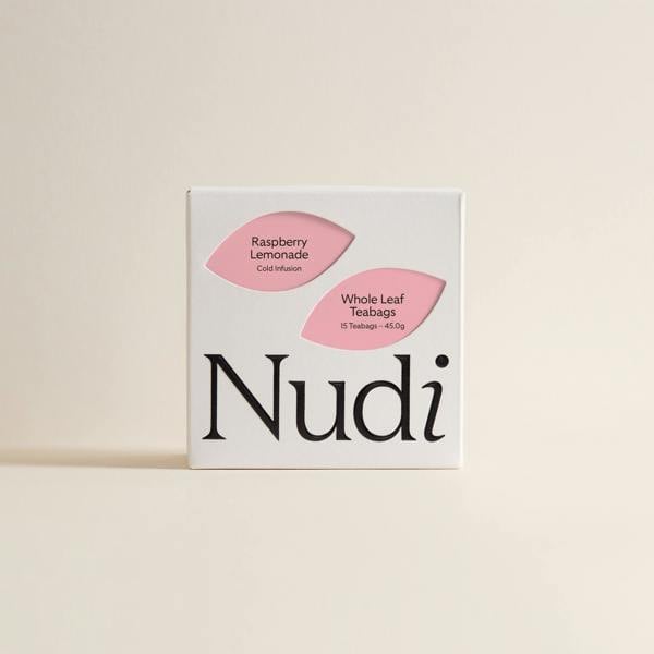 Nuditea raspberry lemonade luxury tea box featuring two pink leaf labels on a white box.