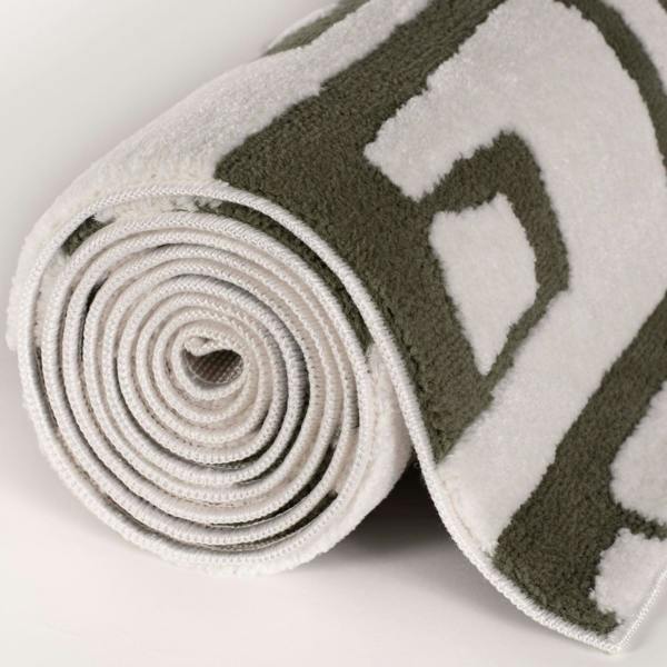 Rolled-up yoga mat with a pattern on a light background