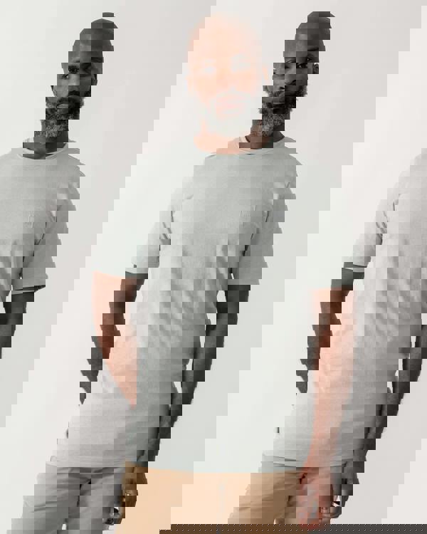 model wearing a BOSS Orange Tales Mens Cotton-Jersey T-shirt With Logo Patch in Silver