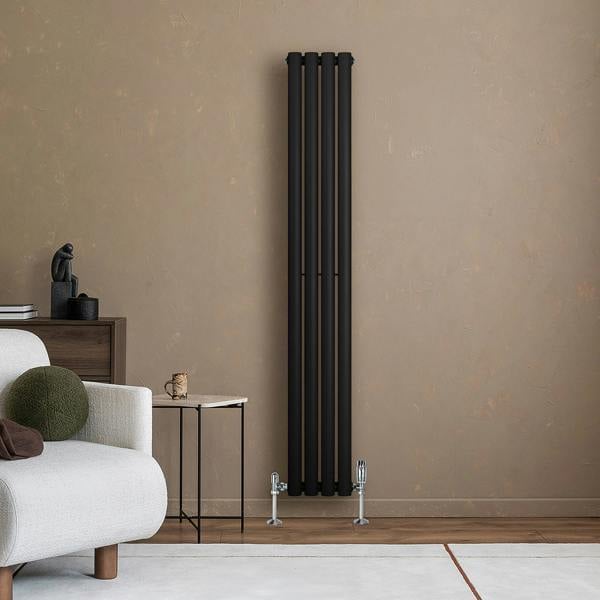 Sleek black oval single column radiator against a textured beige wall, complementing modern interior decor with elegant lines