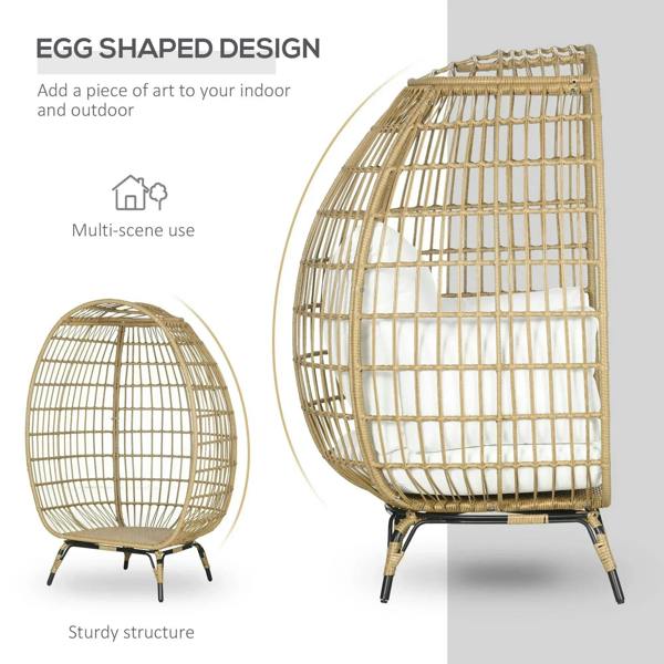Khaki rattan egg chair with white cushions, rounded basket design and curved legs