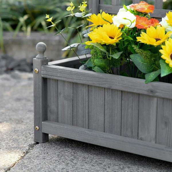 Grey planter box with trellis posts holding a hanging flower basket