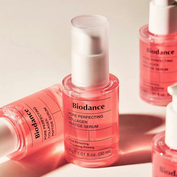 Clear, rich, syrup-like fluid texture of Biodance Pore Perfecting Collagen Peptide Serum absorbing instantly without stickiness onto a face at Atelier De Glow UK.
