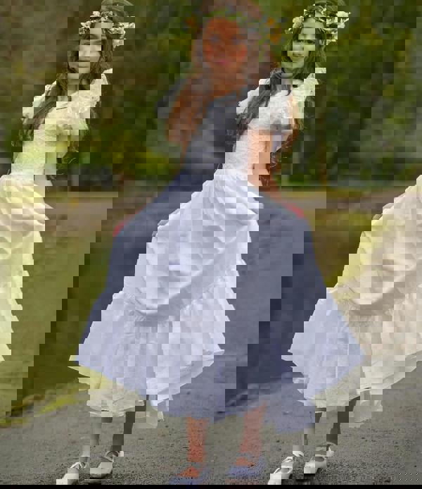 young girl holding dress