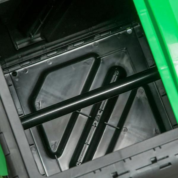 Close-up of rotating compost bin interior with vented panels and support rods