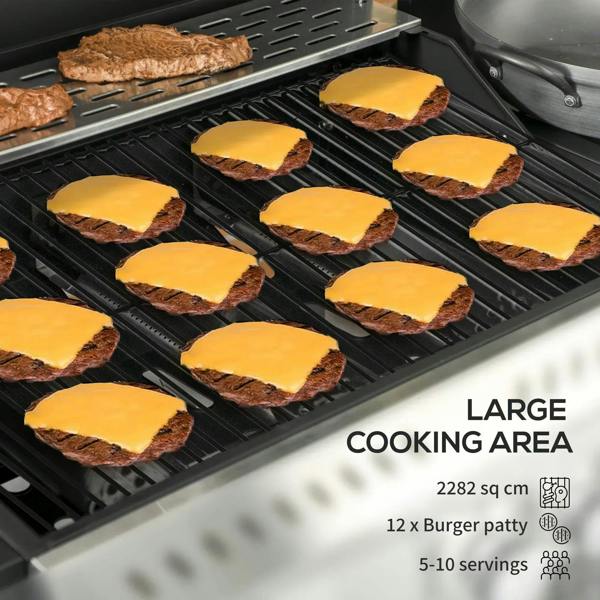 Black grill grates with burger patties and melted cheese on cooking surface