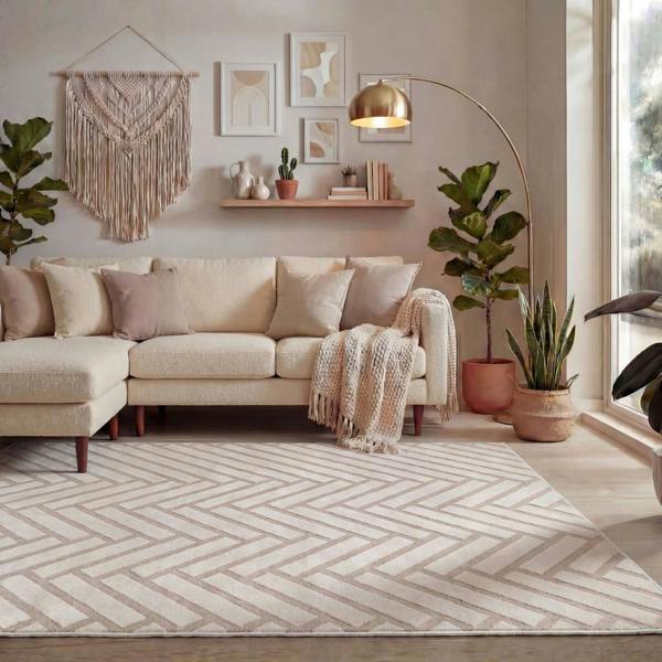 Living room with beige sectional sofa, patterned rug, and decorative elements.
