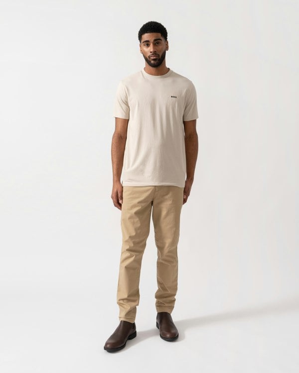 Model wearing BOSS Green Mens Tee Stretch Cotton T-Shirt with Contrast Logo in Light Beige 275 - full length
