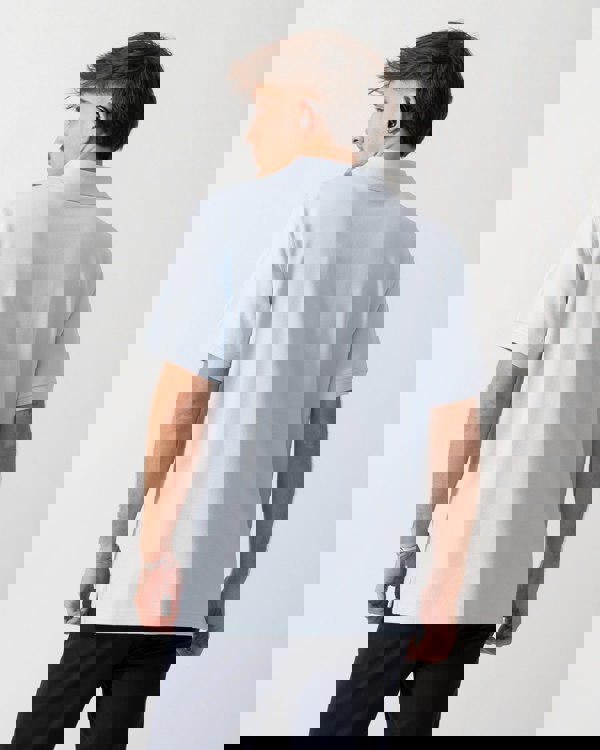 Back of a Model wearing a Belstaff Short Sleeved Mens Polo in Sky Blue