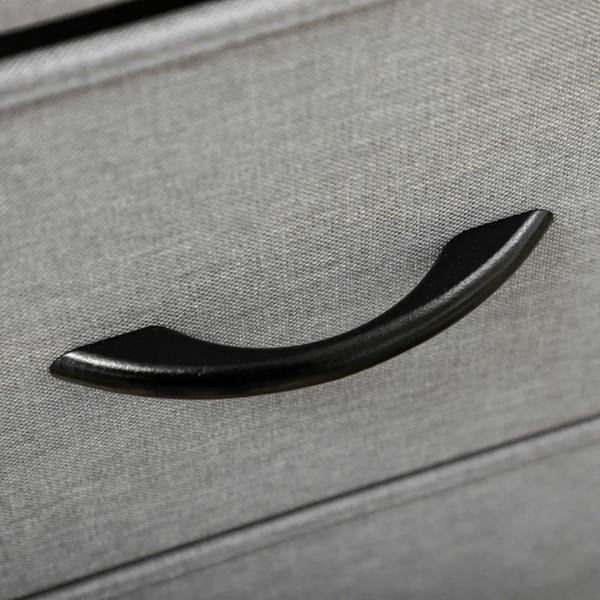 Grey fabric drawer front with a black curved pull handle
