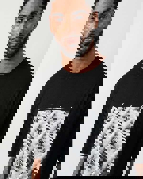 Model wearing HUGO Dodger Graphic T-Shirt in Black 001 - Detail