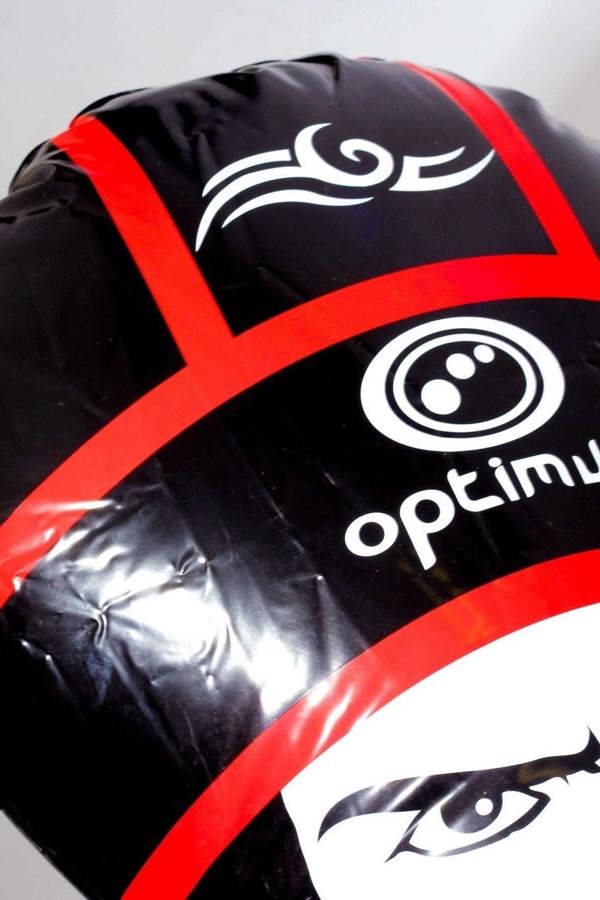 Close-up of red Optimum inflatable tackle buddy's black scrum cap with tribal print and white logo - Optimum