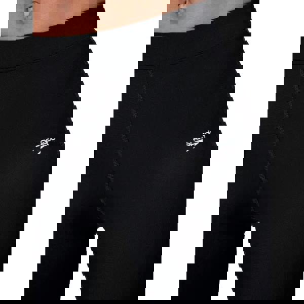 Black Speedo Endurance+ swim shorts with form-fitting leggings and white logo