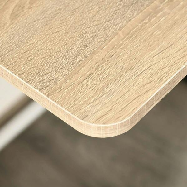 Rounded oak-effect tabletop edge on a white desk with wood-grain finish