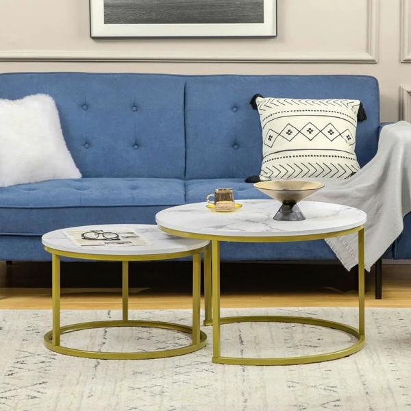 Two round nested tables with white marble-look tops and gold metal frames