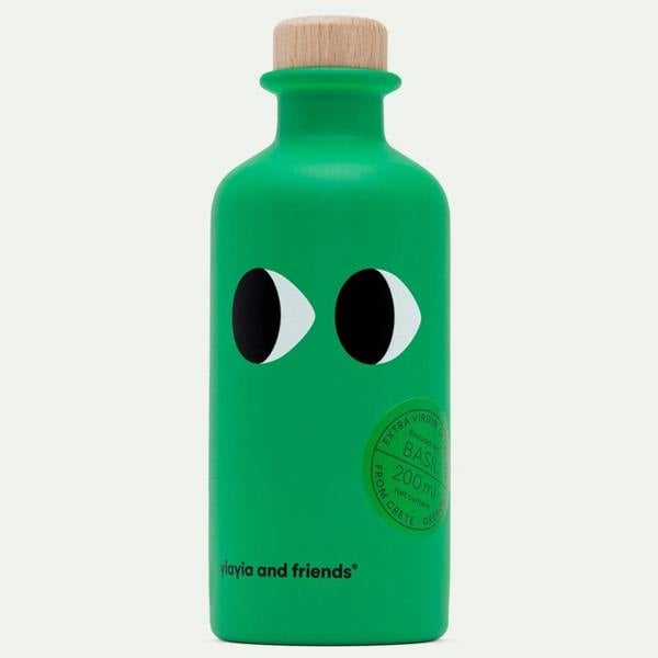 Vibrant green bottle of basil infused extra virgin olive oil 200ml with wooden stopper.
