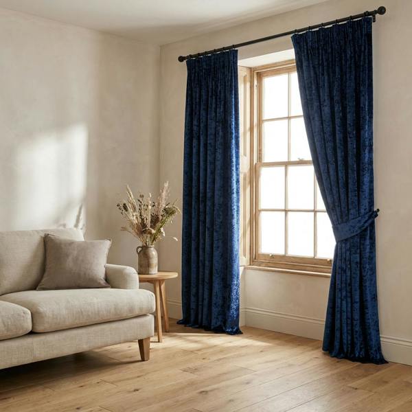 Luxe made-to-measure curtains in Sapphire, styled in a living room