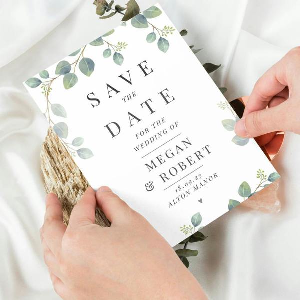 ack of 36 personalised botanical wedding save the date cards featuring green eucalyptus leaves and custom name engraving.