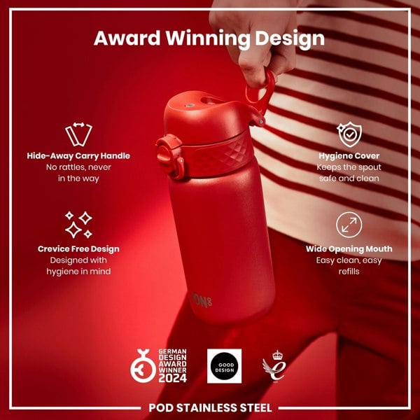 A red stainless steel water bottle is being held; it features a hide-away handle, a hygiene cover, and a wide mouth. The bottle is an award-winning design.