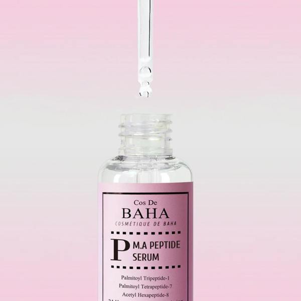 Rich, slippery, and fast-absorbing clear gel texture of Cos De Baha P M.A Peptide Serum smoothing over aging facial matrices at Atelier De Glow UK.