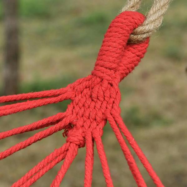Close-up of red braided cotton rope knot and hanging loops for hammock swing