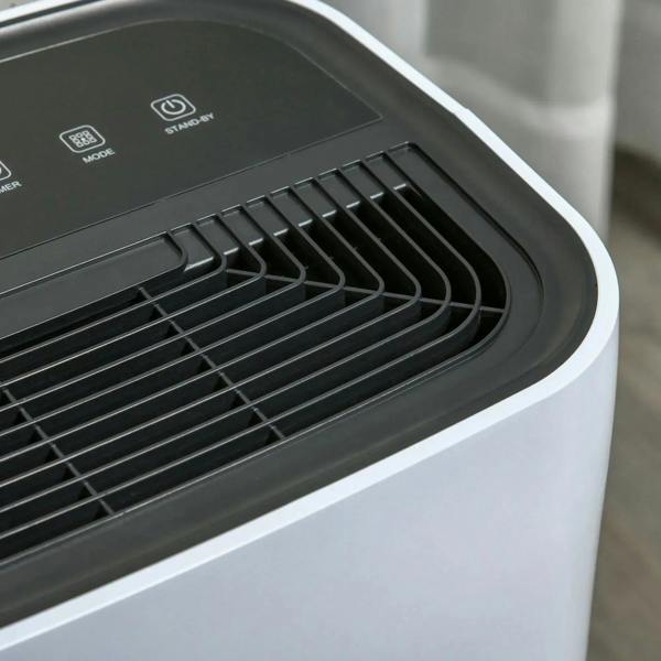 Close-up of black internal grille inside white portable dehumidifier