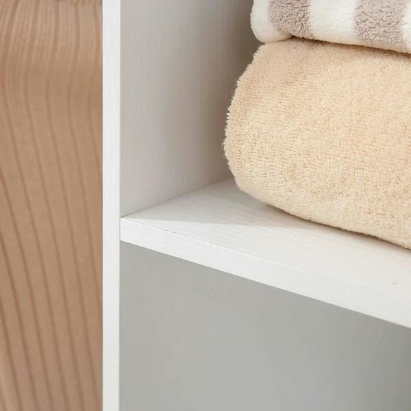 White wardrobe shelf with neatly stacked towels