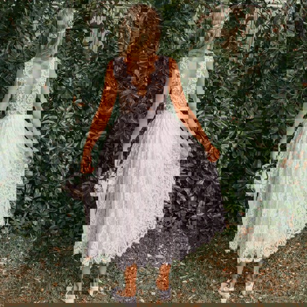 Flower girl in a Beautiful white lace dress