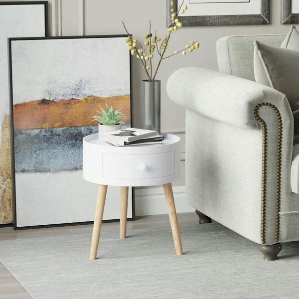 White round bedside table with drawer and light wood legs