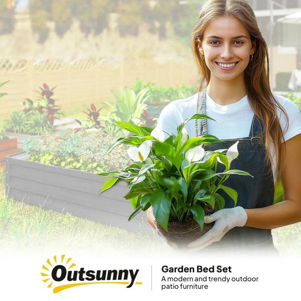 Raised garden bed box with grey metal sides holding potted plants