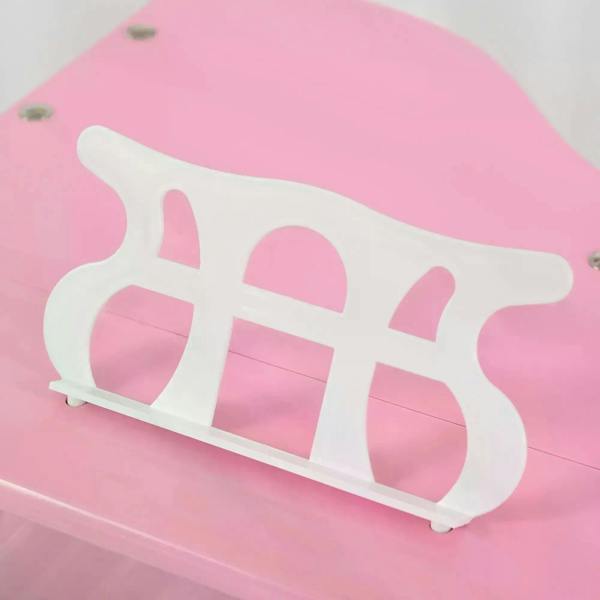 Pink mini kids piano music stand detail with white treble ornament
