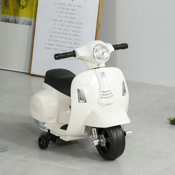 White kids battery-powered scooter front view with headlight, black seat, and wheels