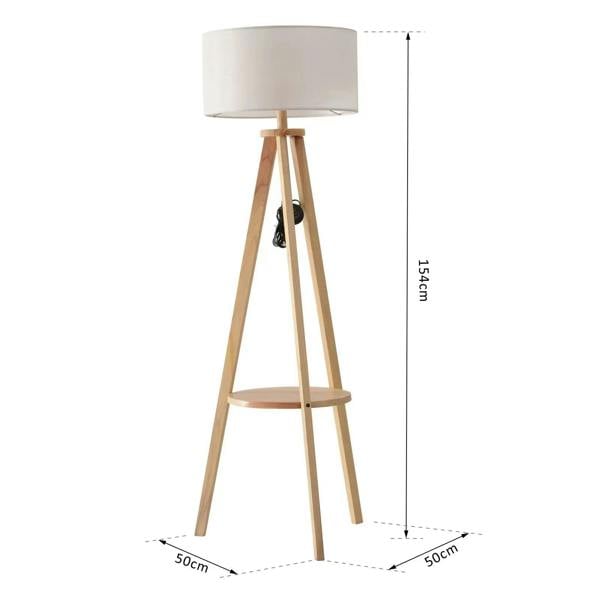 Tripod floor lamp with cream fabric shade and open shelf on natural wood tripod legs
