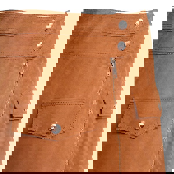 Image displays a close up short of the pop studs on the waistline of the tan suede skirt