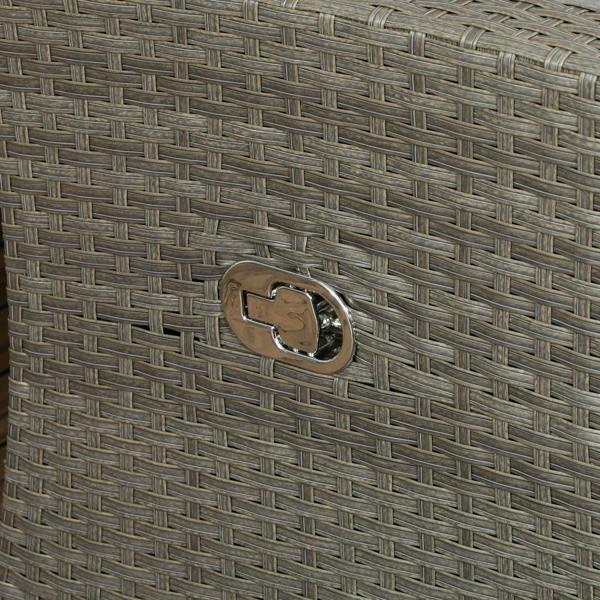Close-up of metal logo plate on grey woven rattan furniture