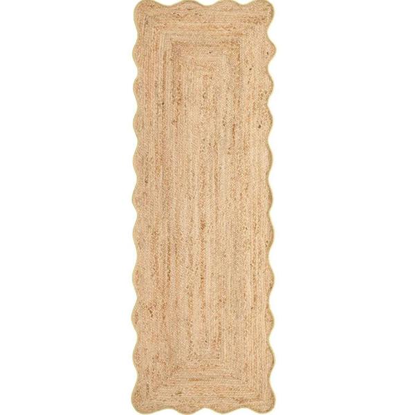Beige braided rug on a white background