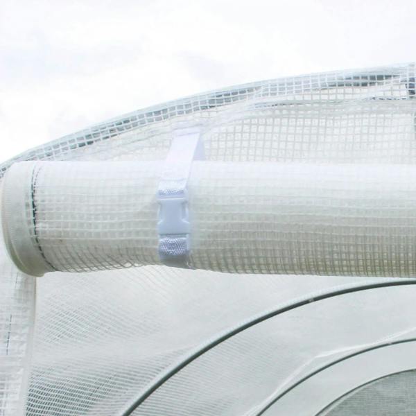 White PE polytunnel cover wrapped and tied on the curved end frame section