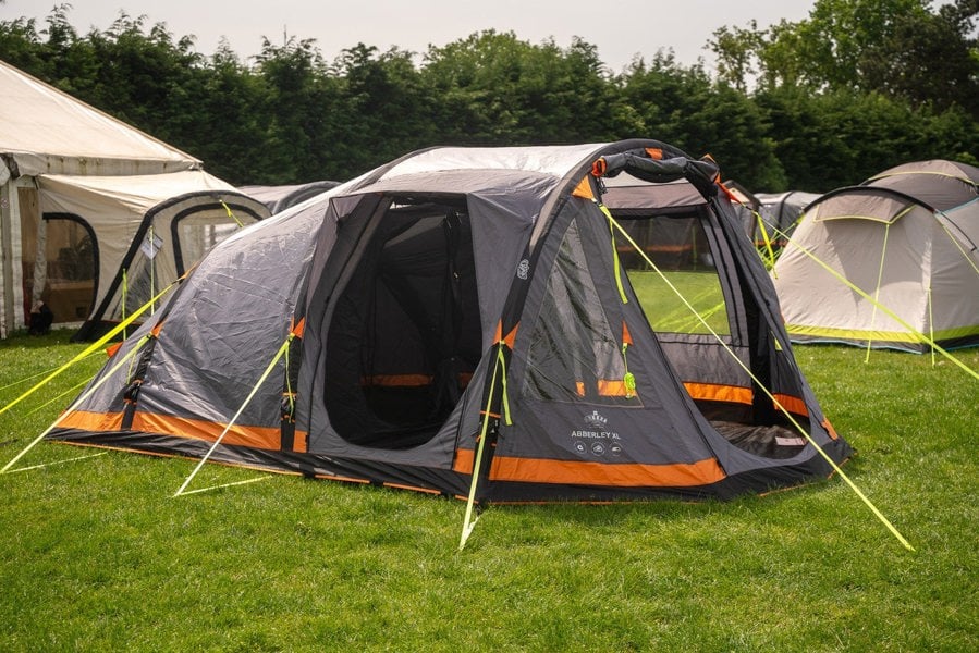 The Abberley Xl Breeze® 4 Berth Inflatable Tent from OLPRO on a campsite with its doors open.