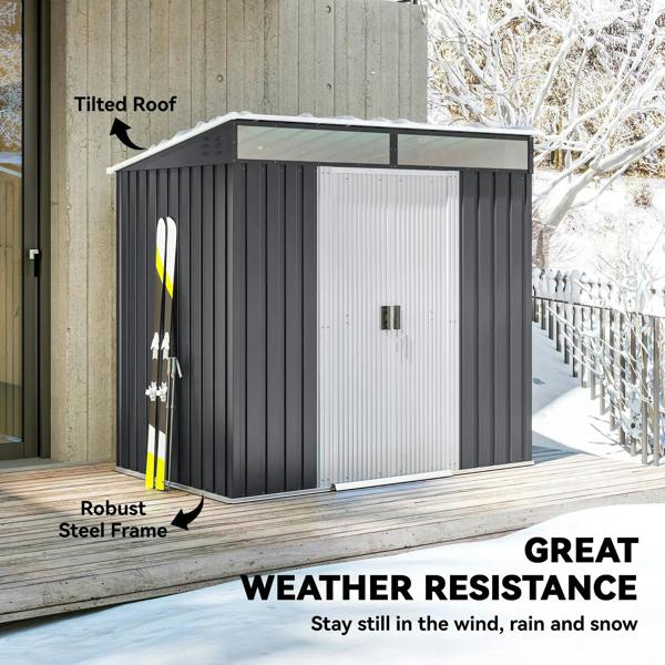 Grey galvanized metal shed with flat roof and vented door panel on deck