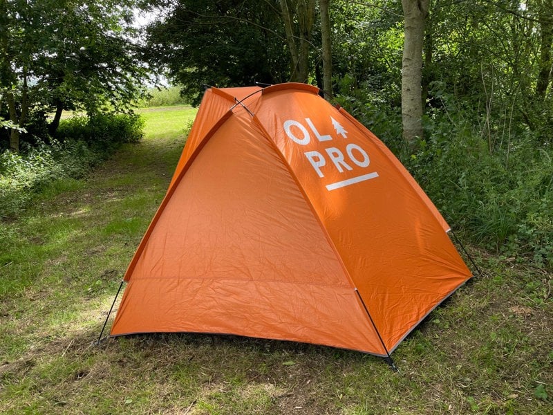 An image from behind the beach tent in orange showing the OLPRO logo.