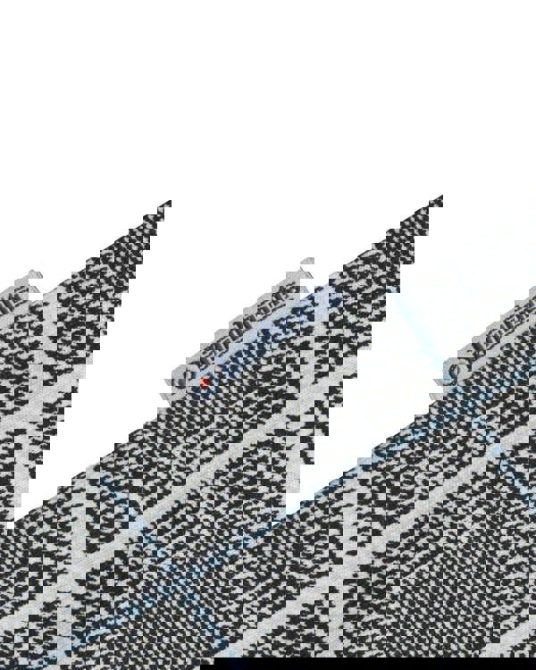 Lambretta Mens Prince of Wales Check Mod Ska Casual Polo, close-up of fabric pattern with label showing Lambretta branding and checkered design.