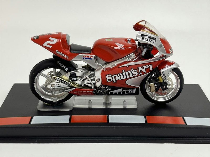 a red motorcycle on a stand