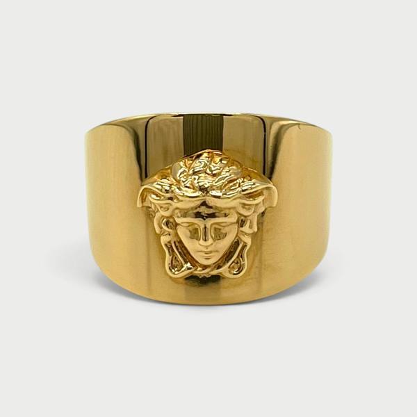 Supplied Fashion gold Medusa head statement ring with a wide band and polished metallic finish.
