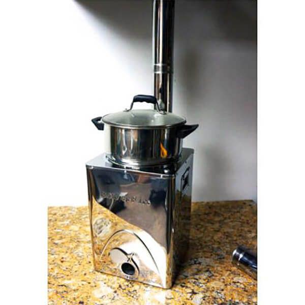 Stainless steel portable stove with pot on a countertop