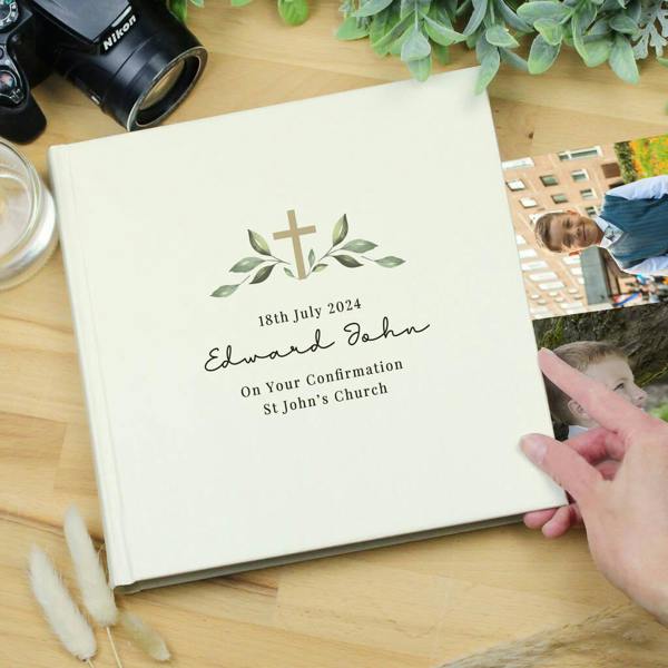 A white square personalised photo album featuring custom engraved text details for a Confirmation ceremony, shown on a white background.